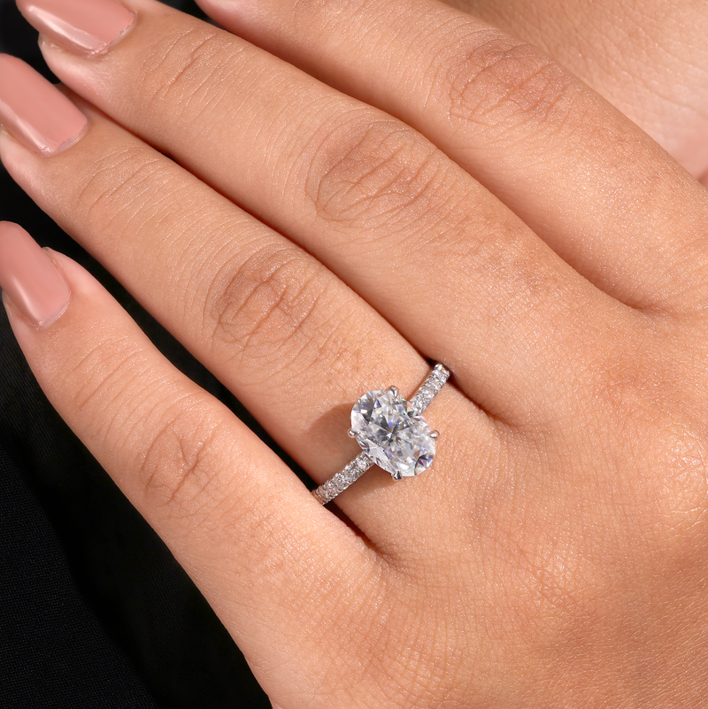 White Gold Oval Diamond Solitaire Engagement Ring With Graduated Pave Band