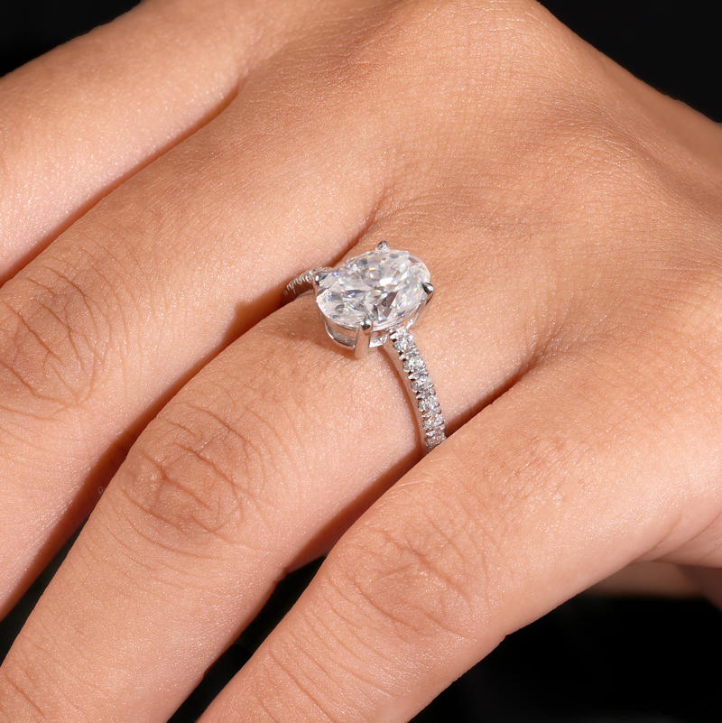 White Gold Oval Diamond Solitaire Engagement Ring With Graduated Pave Band