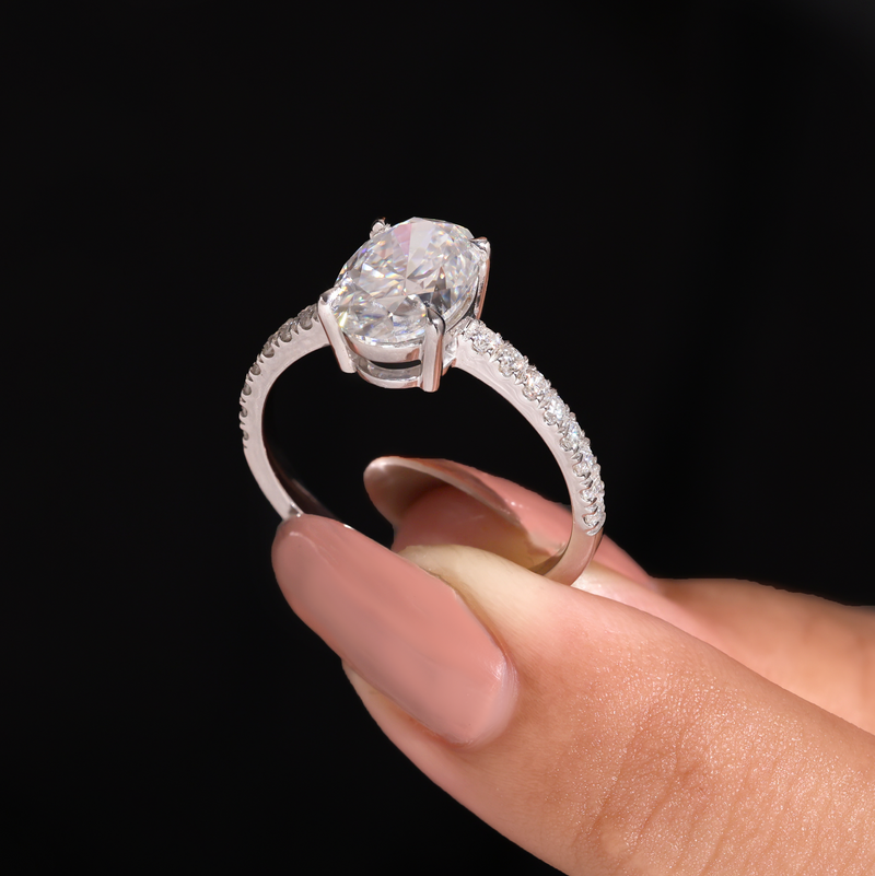 White Gold Oval Diamond Solitaire Engagement Ring With Graduated Pave Band