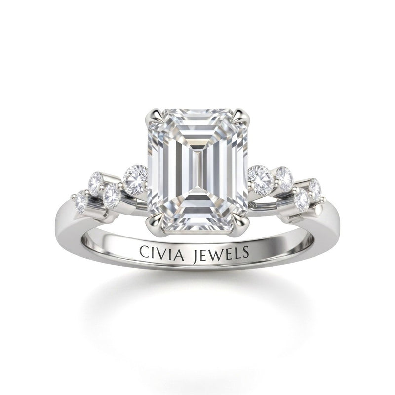 White Gold Emerald Cut Engagement Ring With Diamond Scatter Accent Shoulders And Classic Four-Prong Setting