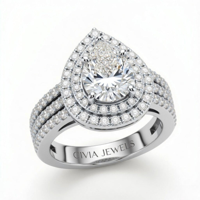 White Gold Pear Cut Double Halo Engagement Ring With Four Prong Setting And Diamond Pavé Split Band
